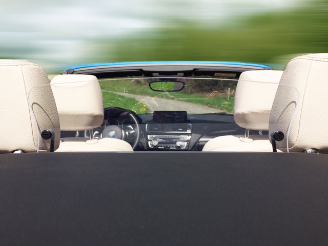 AUCO rear seat wind deflector installed in a convertible – wind protection for rear passengers with the top down